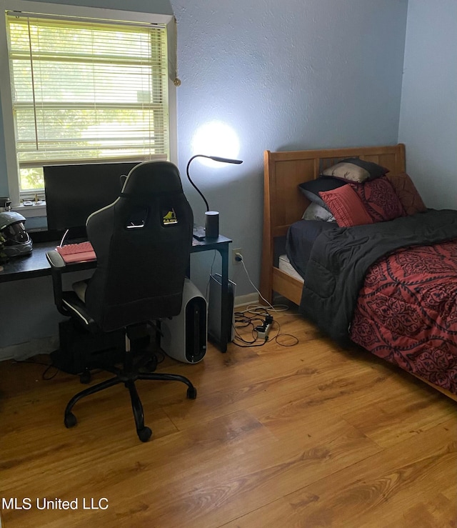 bedroom featuring light hardwood / wood-style flooring