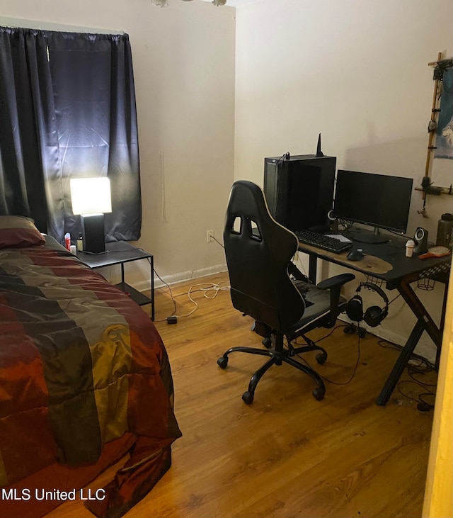 bedroom with wood-type flooring