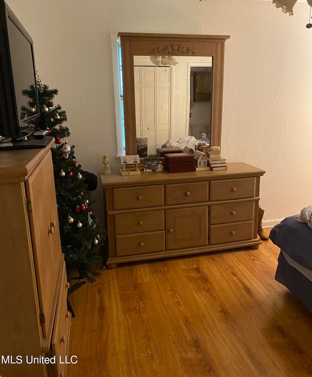 bedroom featuring light wood-type flooring