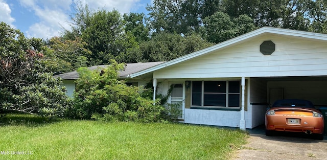 single story home with a front yard and a carport