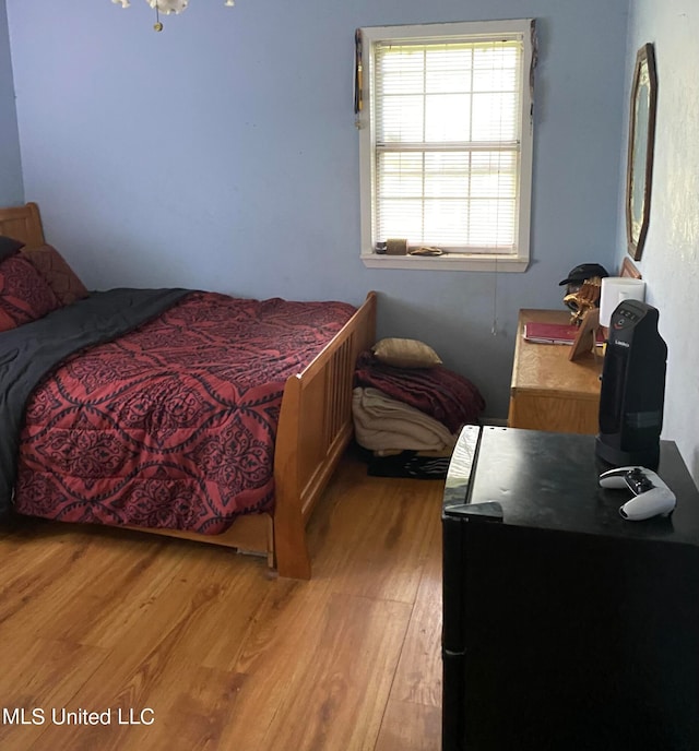 bedroom with light hardwood / wood-style flooring