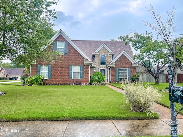 view of front of property with a front lawn