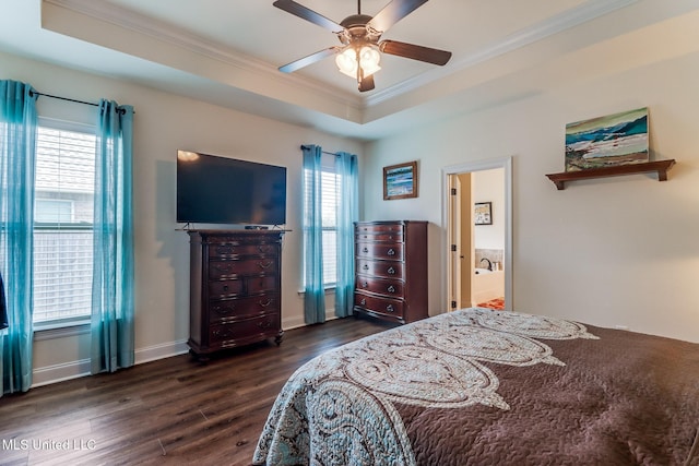 2018 Pelican Cir, Long Beach, MS 39560 - bedroom featuring crown molding, dark wood-style floors, multiple windows, a tray ceiling, and baseboards