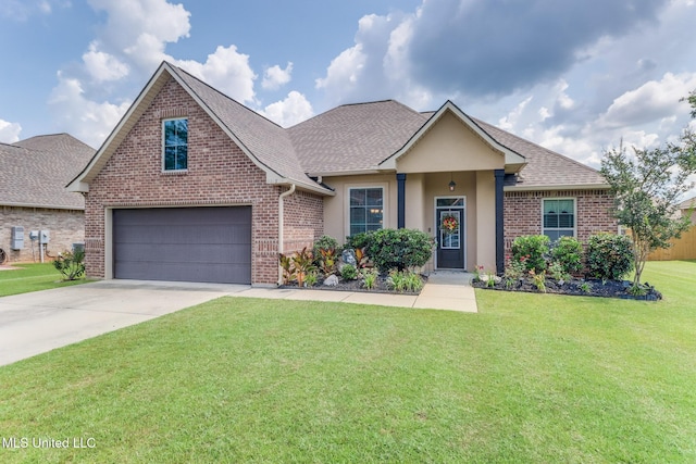 2018 Pelican Cir, Long Beach, MS 39560 - view of front of home featuring driveway, a front yard, a shingled roof, and brick siding