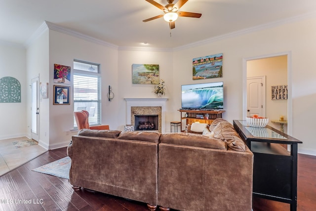 2018 Pelican Cir, Long Beach, MS 39560 - living area featuring ceiling fan, ornamental molding, a fireplace, dark wood-style floors, and baseboards