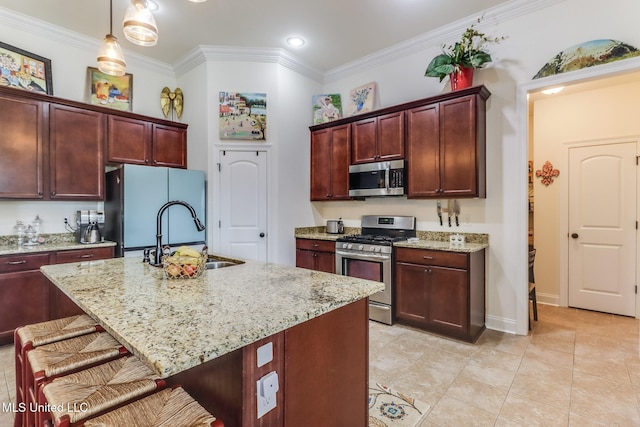 2018 Pelican Cir, Long Beach, MS 39560 - kitchen featuring stainless steel appliances, a sink, ornamental molding, a kitchen bar, and light stone countertops
