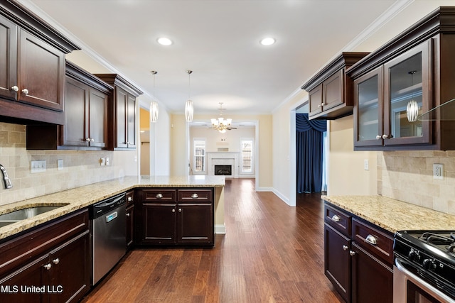 kitchen with sink, crown molding, stainless steel appliances, dark hardwood / wood-style flooring, and decorative light fixtures