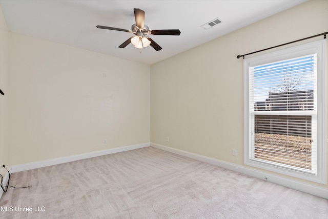 carpeted empty room with ceiling fan