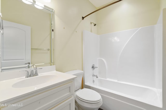 full bathroom with  shower combination, vanity, and toilet