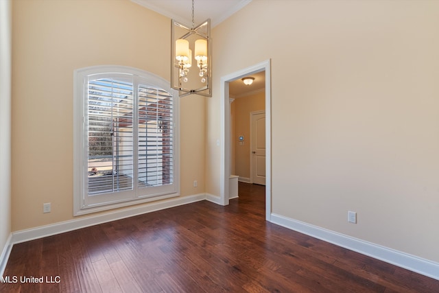 unfurnished dining area with crown molding, a towering ceiling, a notable chandelier, and dark hardwood / wood-style flooring