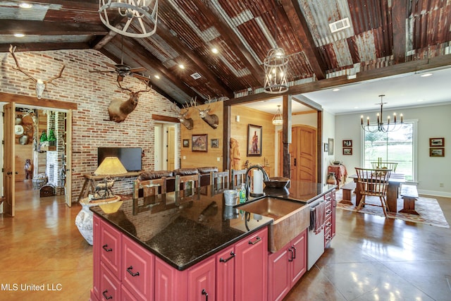 kitchen with ceiling fan with notable chandelier, sink, high vaulted ceiling, beamed ceiling, and an island with sink