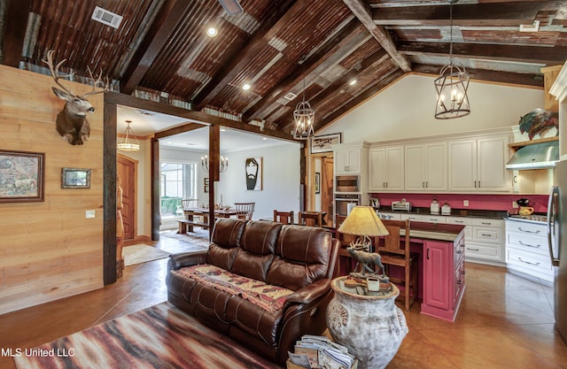 living room featuring tile patterned flooring, vaulted ceiling with beams, wooden walls, and wood ceiling