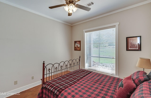 bedroom with ceiling fan and crown molding