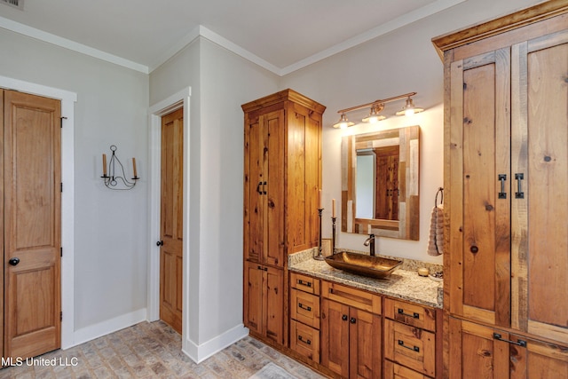 bathroom featuring vanity and ornamental molding