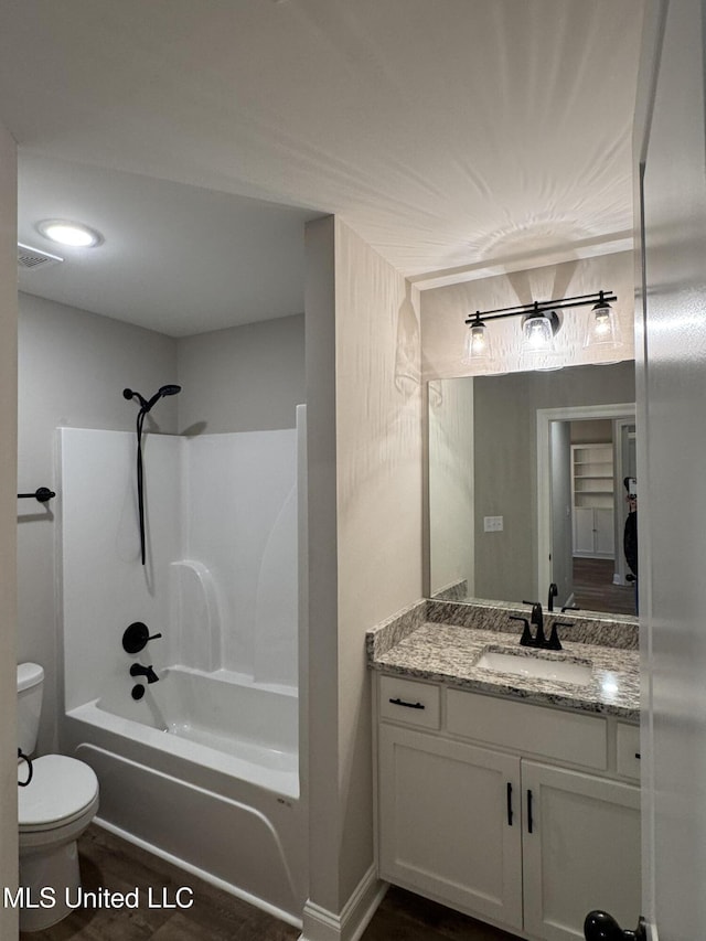 bathroom featuring vanity, shower / bathing tub combination, toilet, and visible vents