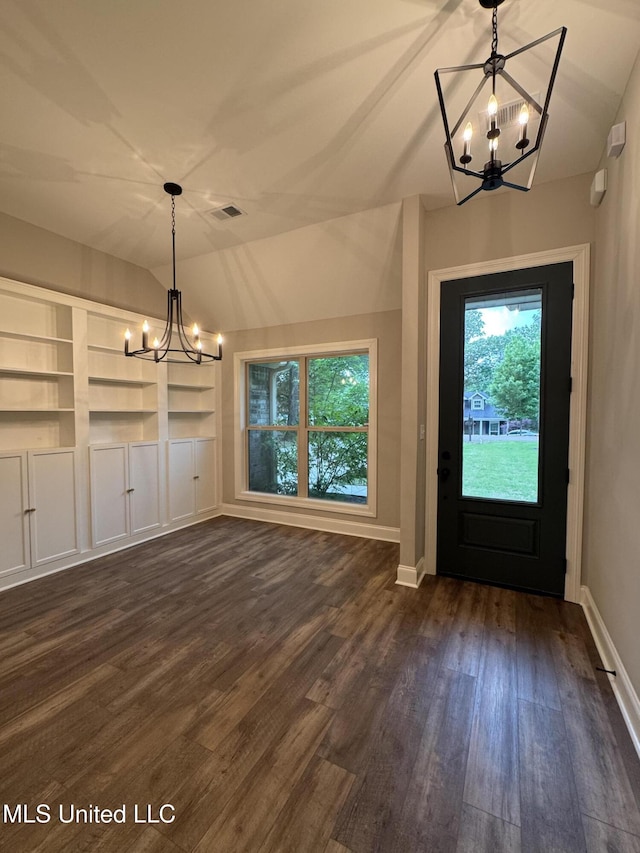 entrance foyer featuring vaulted ceiling, a notable chandelier, dark wood-style floors, and visible vents