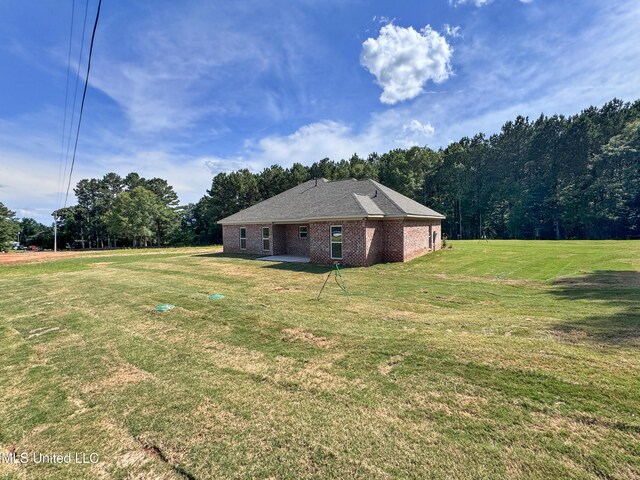158 Walter Jones Rd, Mendenhall, MS 39114 - view of home's exterior featuring a lawn and brick siding