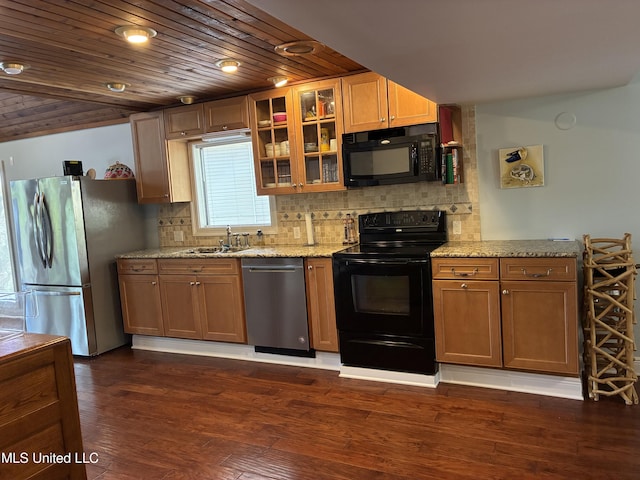 6327 Pontiac Dr, Kiln, MS 39556 - kitchen featuring black appliances, backsplash, glass insert cabinets, and light stone counters