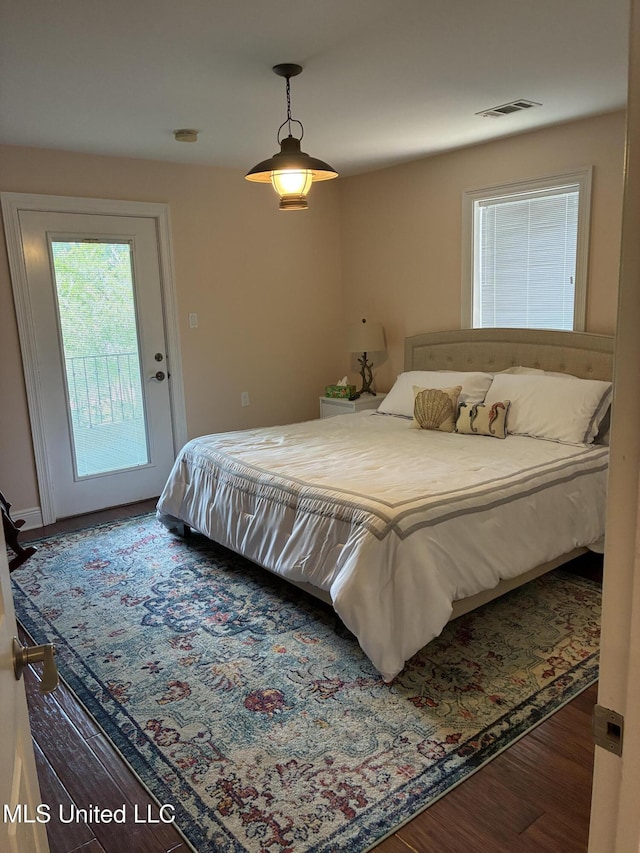 6327 Pontiac Dr, Kiln, MS 39556 - bedroom featuring visible vents, access to outside, and wood finished floors