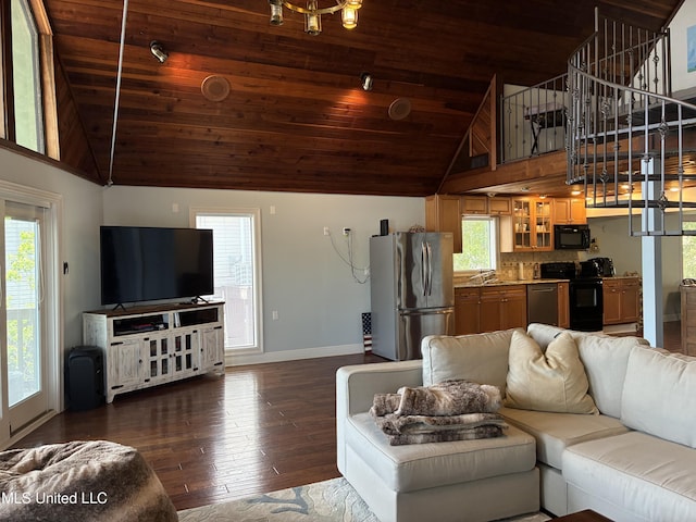 6327 Pontiac Dr, Kiln, MS 39556 - living area featuring baseboards, high vaulted ceiling, and plenty of natural light