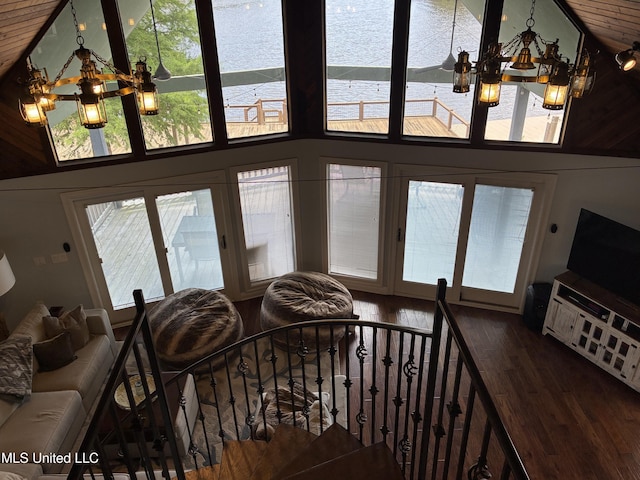 6327 Pontiac Dr, Kiln, MS 39556 - living area with an inviting chandelier, wood finished floors, and high vaulted ceiling
