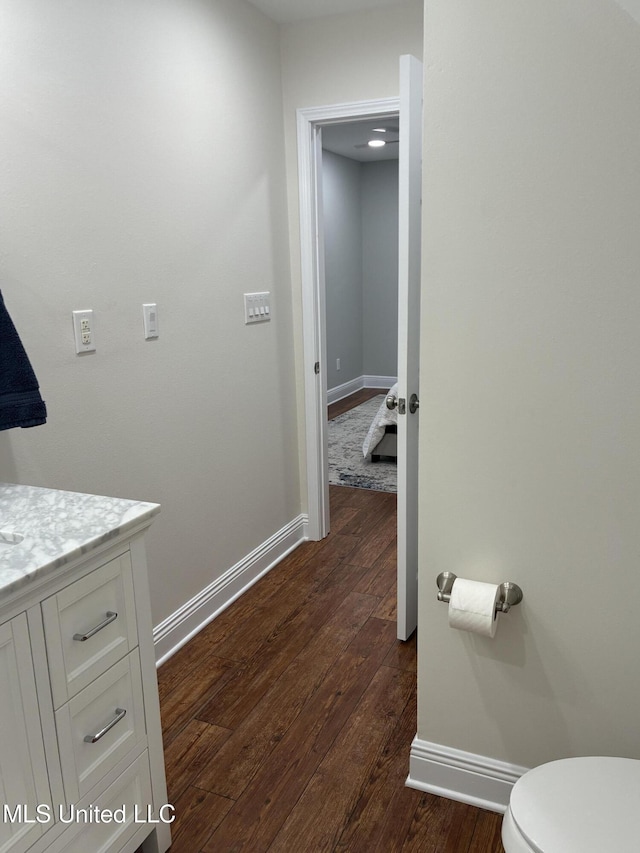 6327 Pontiac Dr, Kiln, MS 39556 - bathroom with wood-type flooring, vanity, and baseboards