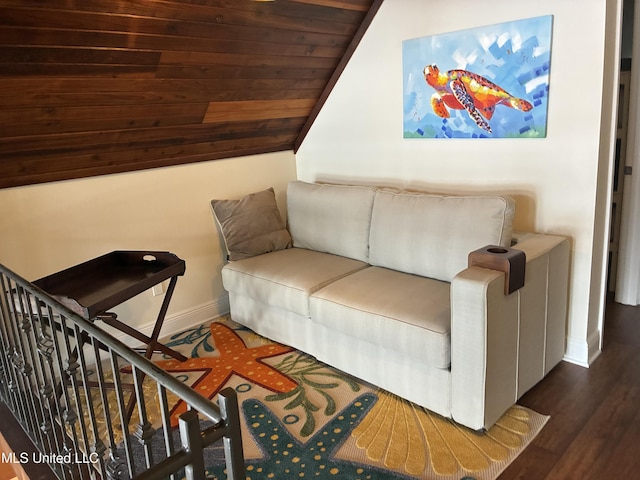 6327 Pontiac Dr, Kiln, MS 39556 - living area with vaulted ceiling, wood finished floors, and baseboards