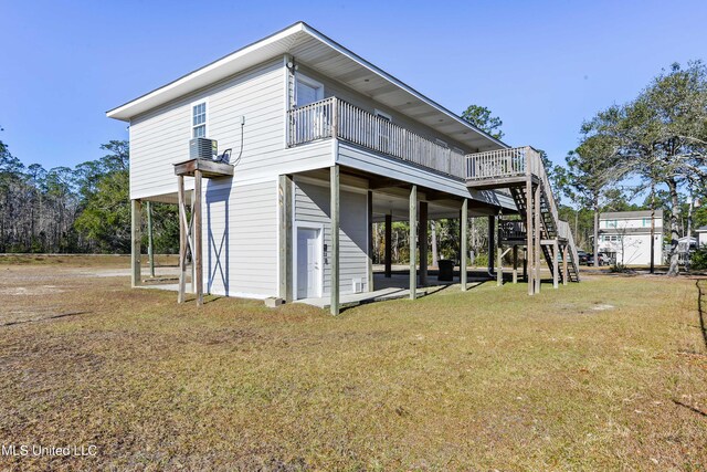 6327 Pontiac Dr, Kiln, MS 39556 - back of house with a deck, stairway, a carport, a patio area, and a lawn