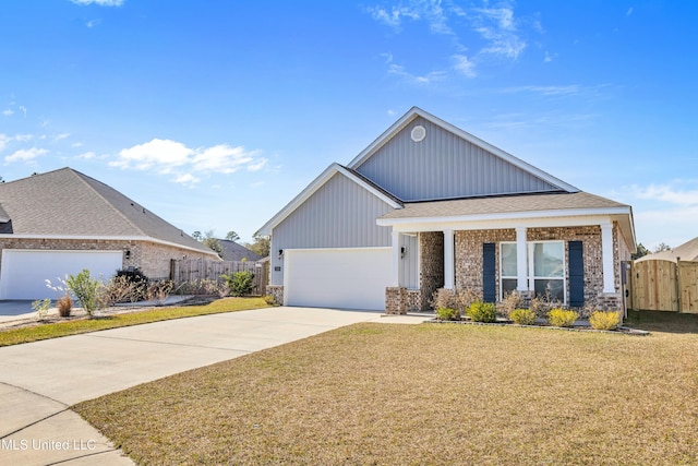 view of front of house with a garage and a front lawn