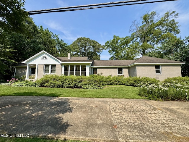 2293 Elm St, Hernando, MS 38632 - ranch-style home with brick siding, a front yard, and a chimney