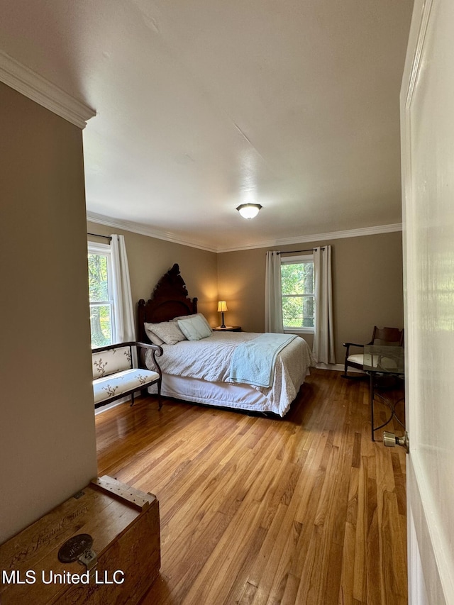 2293 Elm St, Hernando, MS 38632 - bedroom featuring wood finished floors, crown molding, and multiple windows