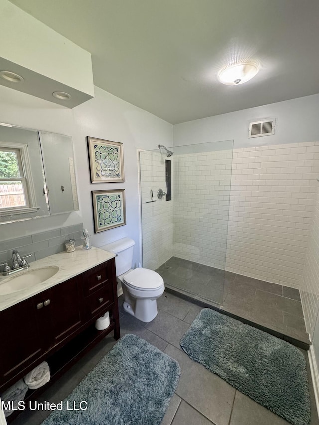2293 Elm St, Hernando, MS 38632 - bathroom featuring toilet, a walk in shower, vanity, and tile patterned floors