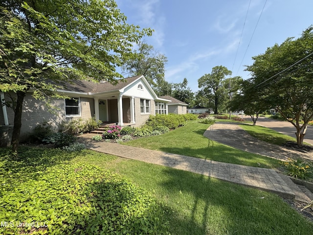2293 Elm St, Hernando, MS 38632 - view of front of property with a front yard and brick siding