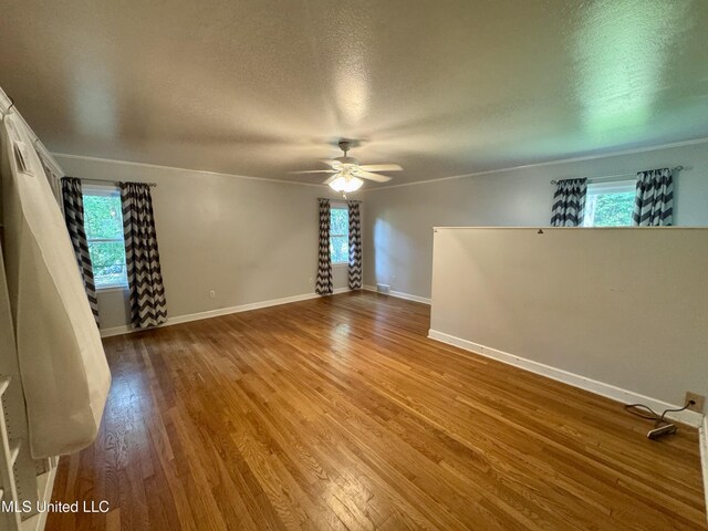2293 Elm St, Hernando, MS 38632 - unfurnished room featuring a ceiling fan, a textured ceiling, wood finished floors, and baseboards