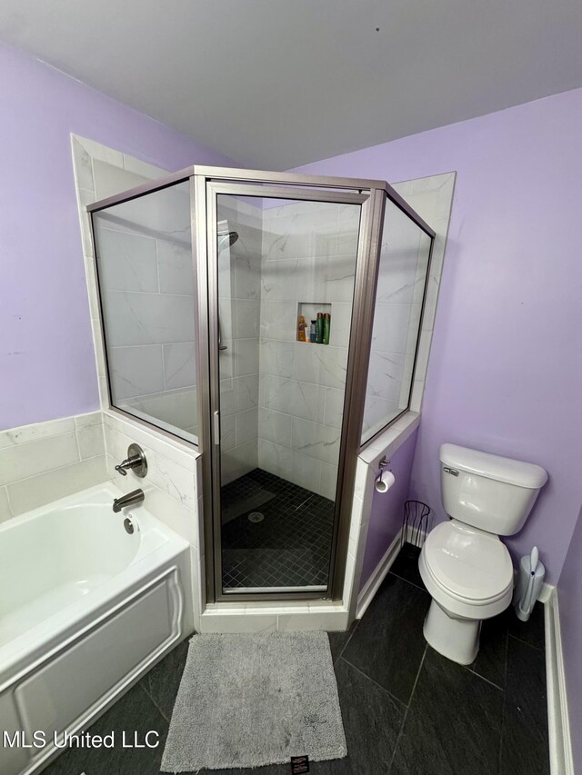 2293 Elm St, Hernando, MS 38632 - full bathroom with toilet, a bath, tile patterned flooring, and a stall shower