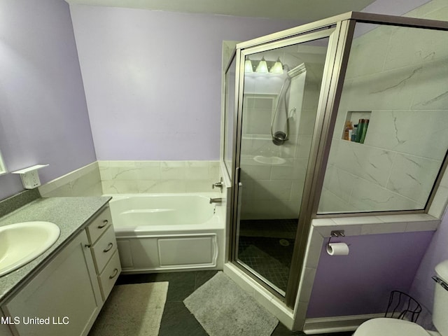 2293 Elm St, Hernando, MS 38632 - full bathroom featuring a bath, vanity, a stall shower, and toilet