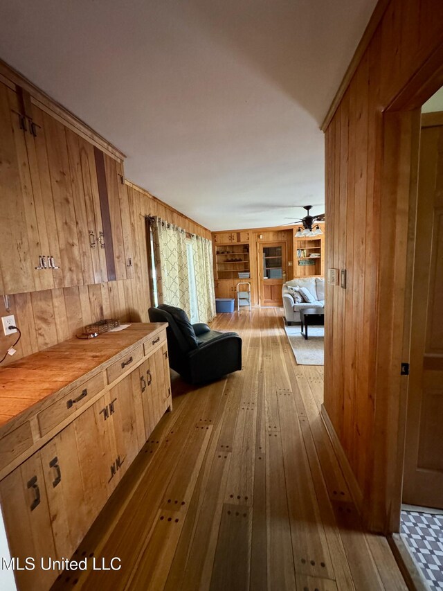 2293 Elm St, Hernando, MS 38632 - hallway with wooden walls and wood-type flooring
