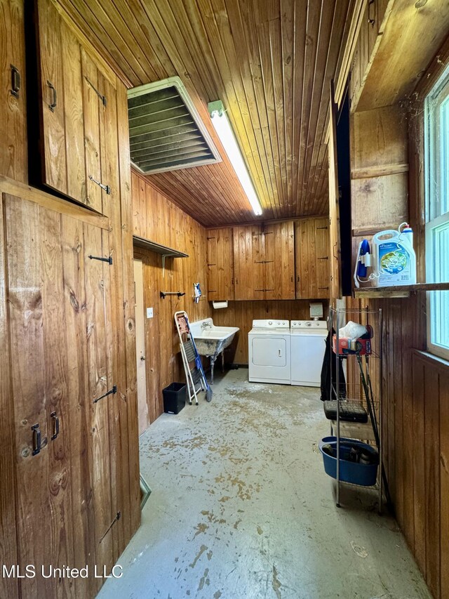 2293 Elm St, Hernando, MS 38632 - miscellaneous room with separate washer and dryer, concrete floors, wood ceiling, wood walls, and plenty of natural light