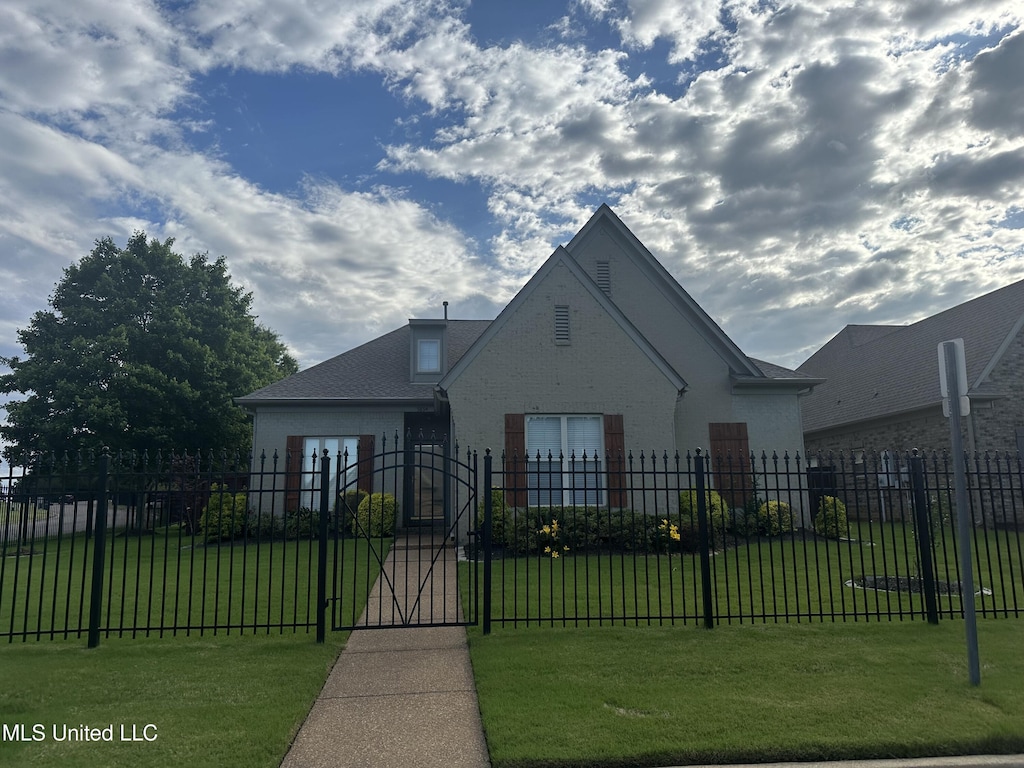 5894 Savannah Pkwy, Southaven, MS 38672 - tudor home with a gate and brick siding