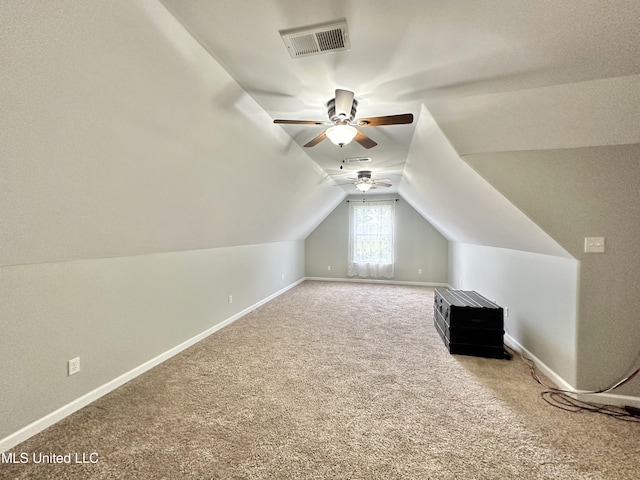 bonus room with visible vents, lofted ceiling, carpet, and baseboards