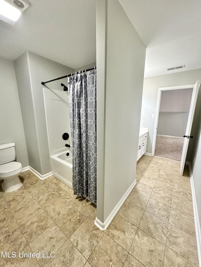 bathroom featuring vanity, toilet, baseboards, and visible vents