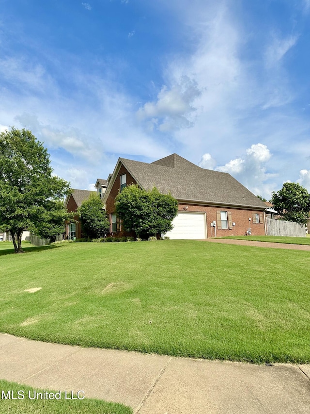 view of side of home with brick siding, a lawn, a garage, and a shingled roof