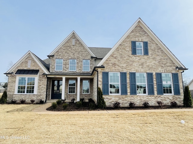 craftsman-style home with a front yard