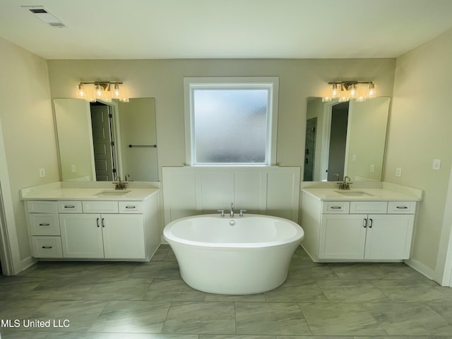 bathroom featuring vanity and a bathing tub