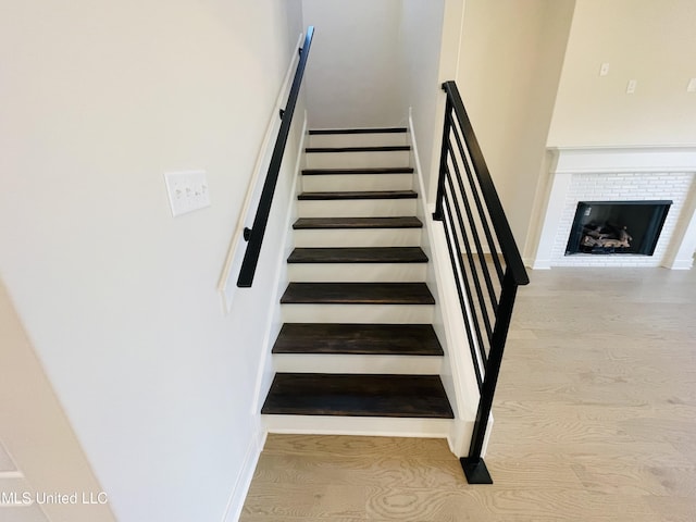 stairs featuring wood-type flooring