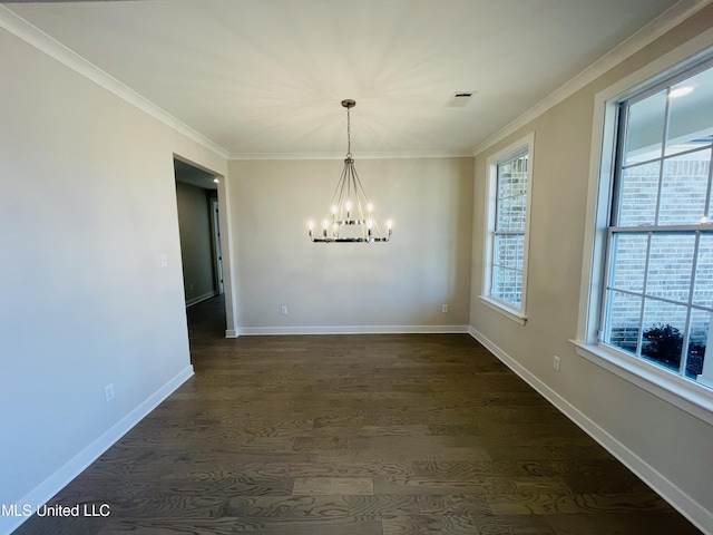 unfurnished dining area with dark hardwood / wood-style flooring, a chandelier, and crown molding