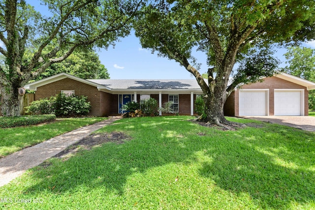 120 Pitcher Pt, Long Beach, MS 39560 - ranch-style house featuring a garage, driveway, and brick siding