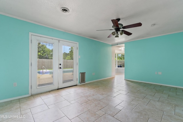 120 Pitcher Pt, Long Beach, MS 39560 - unfurnished room featuring plenty of natural light, french doors, a ceiling fan, crown molding, and baseboards