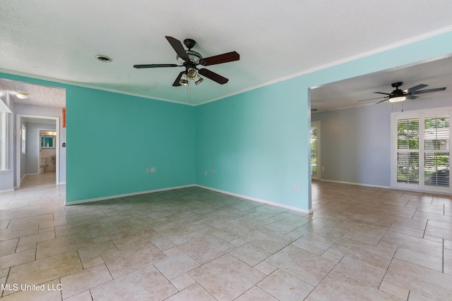 120 Pitcher Pt, Long Beach, MS 39560 - empty room featuring a ceiling fan, baseboards, light stone finish floors, and ornamental molding