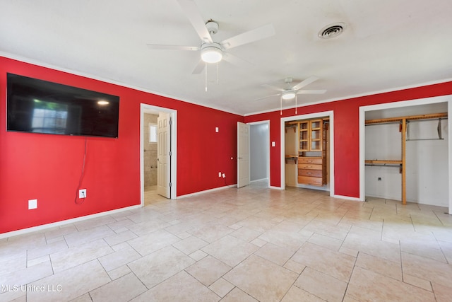120 Pitcher Pt, Long Beach, MS 39560 - unfurnished bedroom with multiple closets, baseboards, crown molding, ceiling fan, and ensuite bath